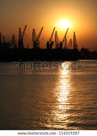 Sunset at the industrial zone on the sea port