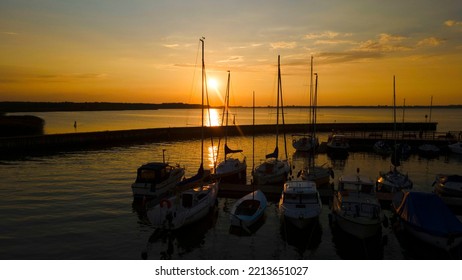 Sunset At Lake Marina With Boats