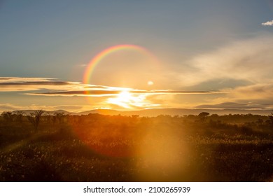 Sunset Landscape With Rainbow And Lens Flare In South Africa