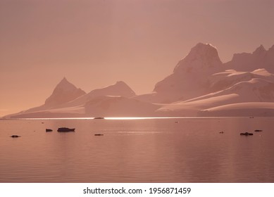 Sunset Lemaire Strait Coastal Landscape, Mountains And Icebergs, Antarctic Peninsula, Antartica.