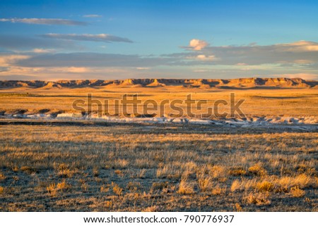 Sunset light over Pawnee National Grassland in northern Colorado, typical winter or fall scenery with a dry grass