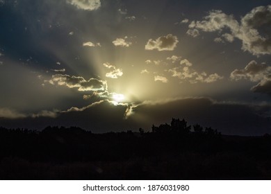 Sunset with light rays in the clouds