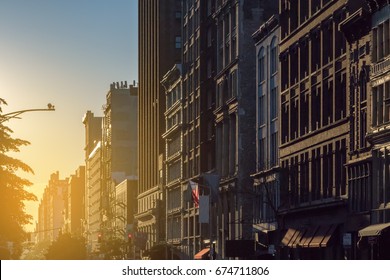 Sunset light shines on a block of buildings in New York City NYC