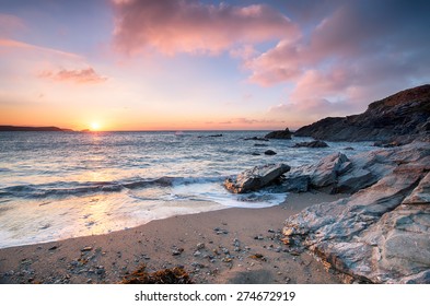 Sunset from Little Fistral beach, a small sheltered cove beneath the Towan headland at Newquay on the Cornish coast - Powered by Shutterstock