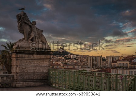 Gargoyle on Notre Dame In Paris at sunset