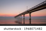 Sunset and moon rise at the same time at New Brighton Pier, Christchurch, New Zealand