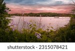 Sunset and a moored boat over the Mystic River in Connecticut