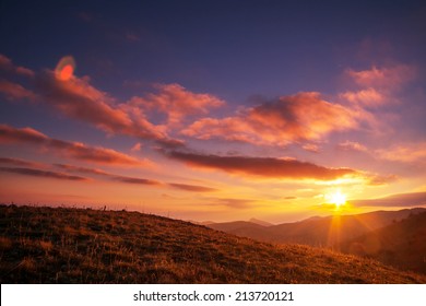 Sunset In Mountains