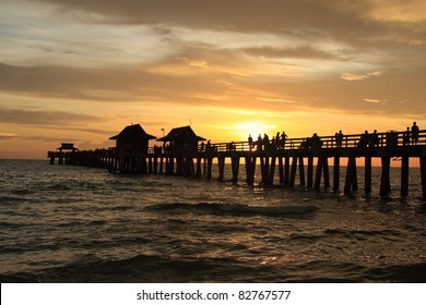 Sunset In Naples Pier On Beach Golf Of Mexico, Florida