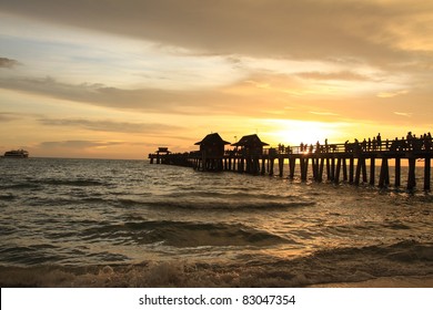 Sunset In Naples Pier On Beach Golf Of Mexico, Florida