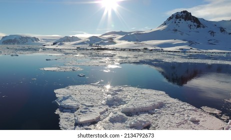 Sunset Near The Mountain In Antartica