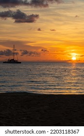 Sunset In Negril Beach Jamaica With Catamaran Cruise Ship