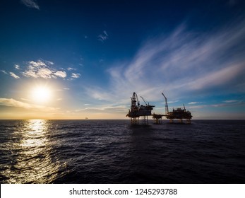 Sunset In North Sea With A Oil Platform. 