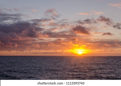 sunset in ocean with cloud