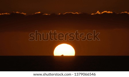 Sunset in the ocean. Nightfall.