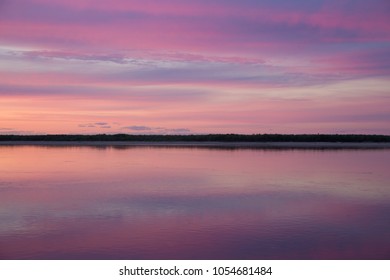 Sunset on the Aldan River, Siberia, Russia - Shutterstock ID 1054681484