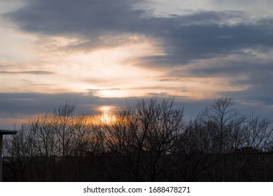 Sunset on a background of gray clouds. Evening landscape.