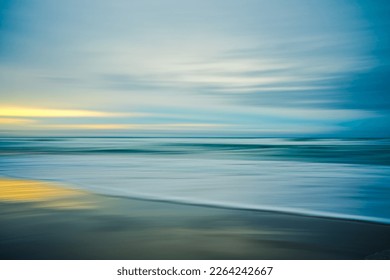 Sunset on the beach, abstract. Motion blur abstract seascape in light turquoise and yellow colors, copy space - Powered by Shutterstock