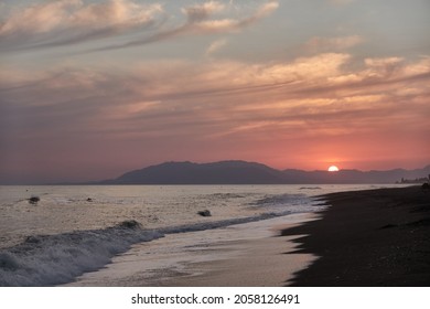 Sunset on the beach of Benajarafe. Malaga. Andalusia. Spain.