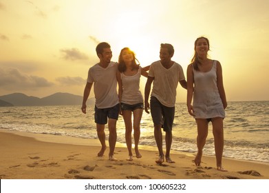 Sunset On The Beach With Friends