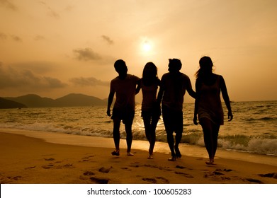 Sunset On The Beach With Friends