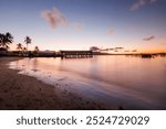 Sunset on the beach in Port Douglas QLD out to the wharf boatshed