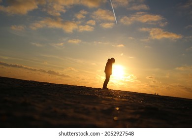 Sunset On The Beach With Snow