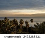 sunset on the beach, View of the sea of Galilee (Kineret lake), Israel .