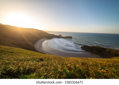 sunset on beach with waves
