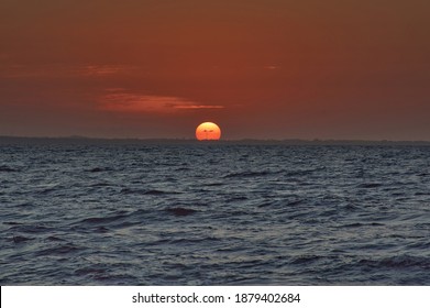 Sunset On The Beaches Of Coveñas In Colombia Over The Salty Sea In The Afternoon Of 7 Pm Pm Dark Orange Sky Ascuro Blue Sea