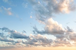 Sunset On Blue Sky. Blue Sky With Some Clouds. Blue Sky Clouds, Summer Skies, Cloudy Blue Sky Background. Aerial Sunset View.  Evening Skies With Dramatic Clouds. View Over The Clouds.