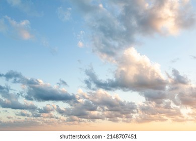 Sunset on blue sky. Blue sky with some clouds. blue sky clouds, summer skies, cloudy blue sky background. Aerial sunset view.  Evening skies with dramatic clouds. View over the clouds. - Shutterstock ID 2148707451