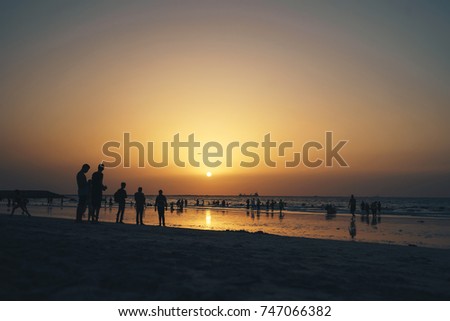Sunset on a Busy Beach with Lots of People. Location Dubai United Arab Emirates