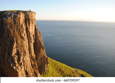 Sunset on a cliff - Shutterstock ID 660709297