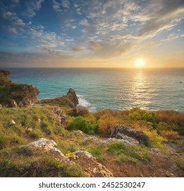 Sunset on cliffs. Beautiful spring nature and sea landscape. Relax composition.