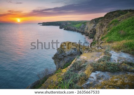 Sunset on cliffs. Beautiful spring nature and sea landscape. Relax composition.