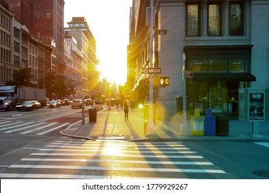 Sunset On The Corner Of 23rd Street And 5th Avenue With People And Cars In Manhattan, New York City NYC