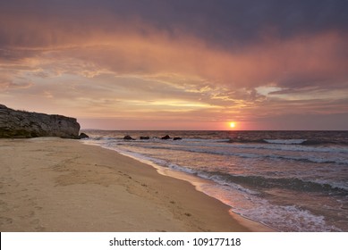 sunset on the deserted beach in the Crimea
