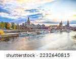Sunset on Elbe river with panorama of Cathedral of the Holy Trinity or Hofkirche, Bruehl