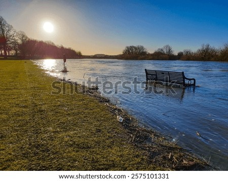 Sunset on a flooded river Trent in Nottingham, UK.
