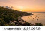 Sunset on the island of Bali with Amed beach and Mount Agung in the background. Timelapse. Indonesia