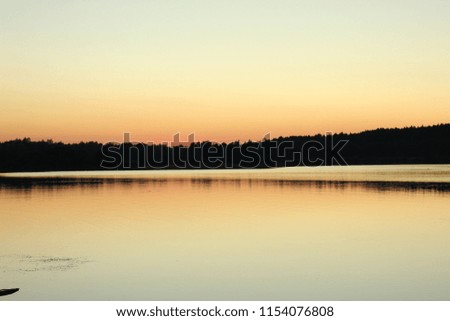 Similar – Morgensonne scheint auf den Dunst über einem See