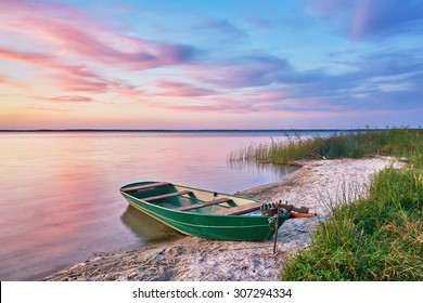 Sunset On The Lake, Fishing Boat On The Shore