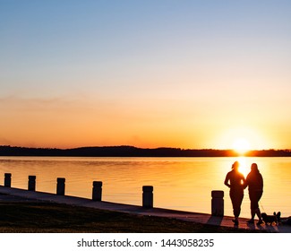 Sunset On Lake Mendota In Madison, Wisconsin With People In Foreground