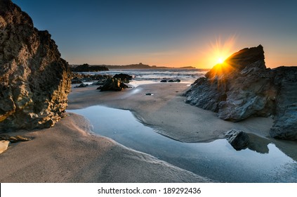 Sunset on Lusty Glaze beach at Newquay in Cornwall - Shutterstock ID 189292436