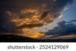 Sunset on a mountain at the edge of the forest. Sonnenuntergang auf einem Berg am Waldrand.