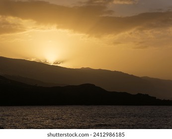 sunset on the mountains with clouds