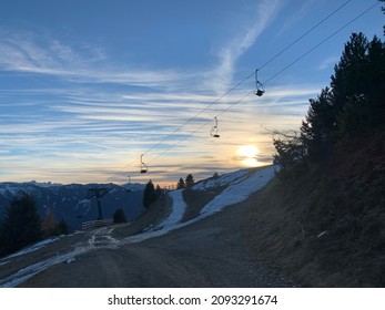 Sunset on the mountains with a omd skilift.