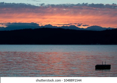 Sunset on the Olympic Mountains photographed from Highway 106 on Hood Canal in Washington State, USA.