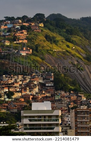Sunset on precariously located favelas and middle class buildings of the Zona Norte, or North Zone, of Rio de Janeiro, Brazil